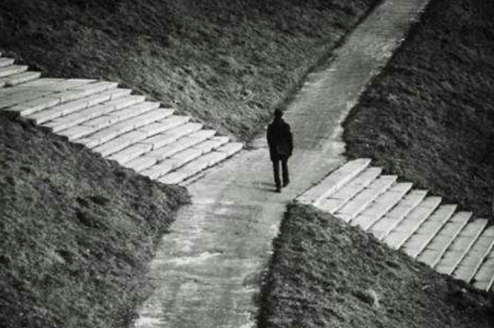 a man standing in 4 way path. Which is the best way to go make a choice, just like AB testing. 